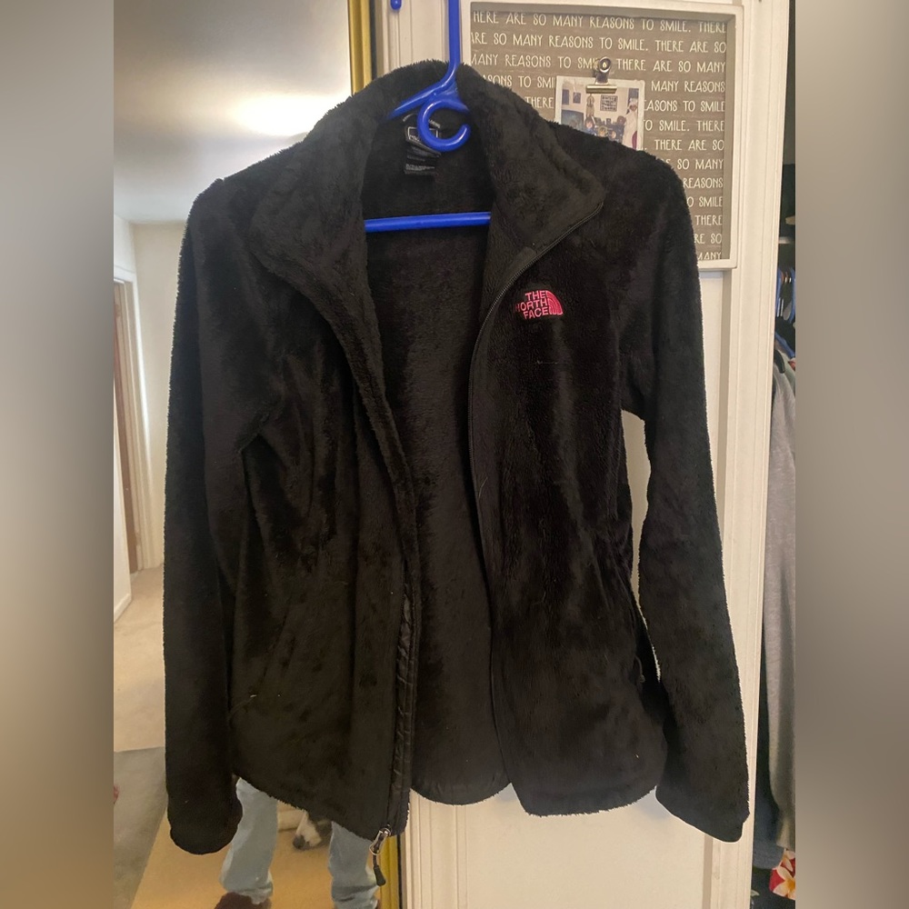 Pink and black north face jacket
